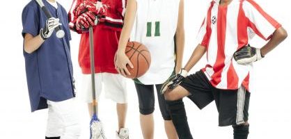 Kids in different sports uniforms