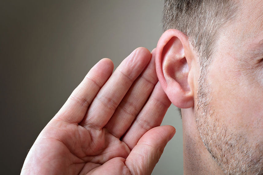 man holding ear